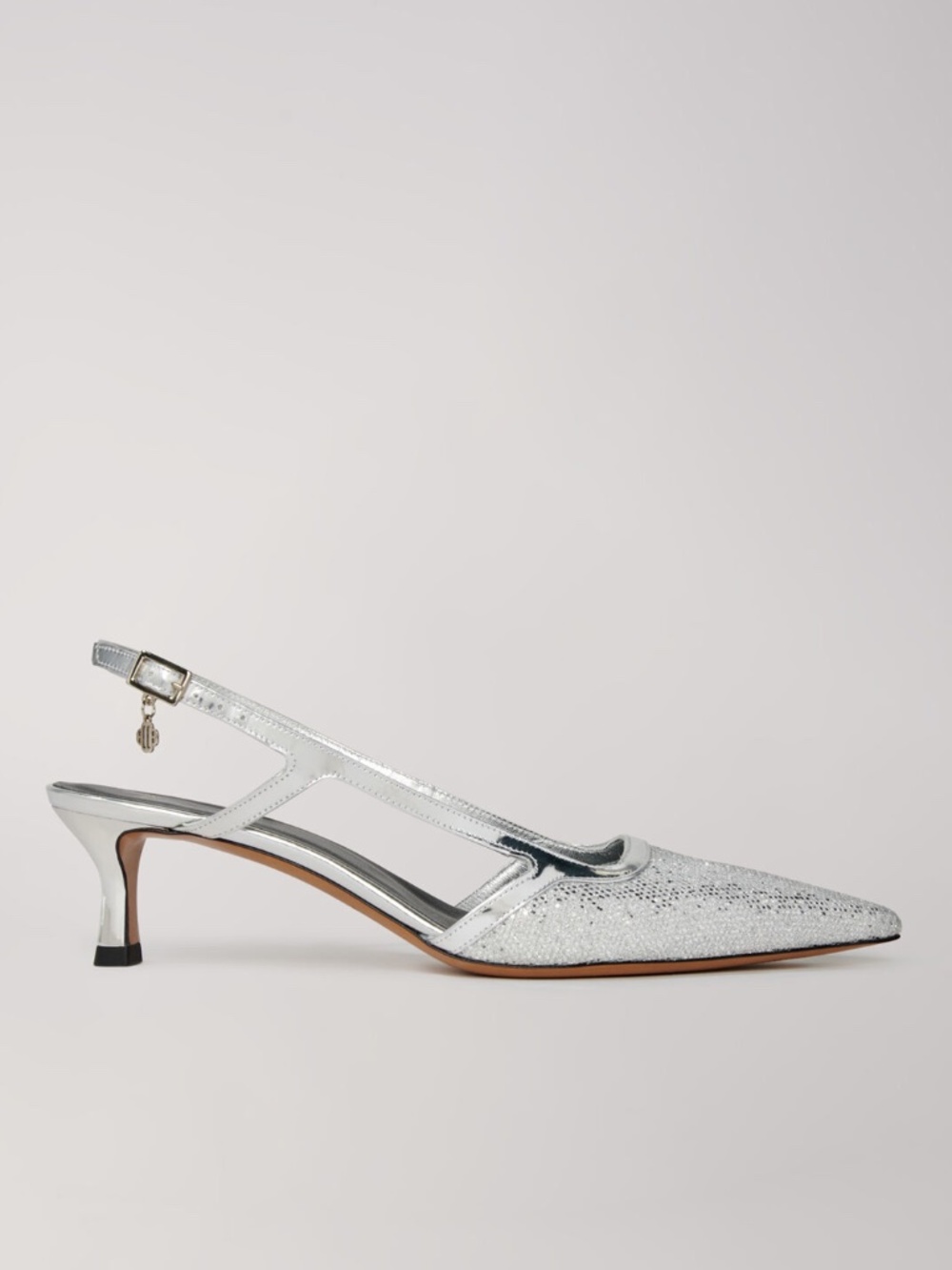 Pointed silver pumps